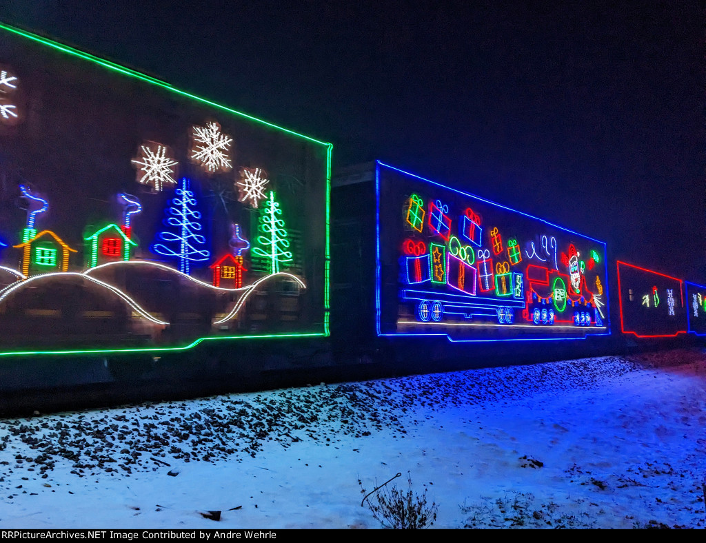 CP 220127, a box car adorned with glowing gift boxes